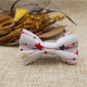 Christmas Baby Bow Tie White With Red Garland
